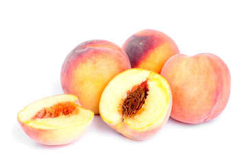 whole and sliced peach isolation on white