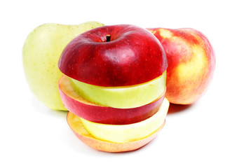 Green and red sliced  and whole apple on white background