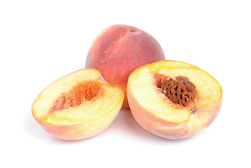 whole and sliced peach isolation on white