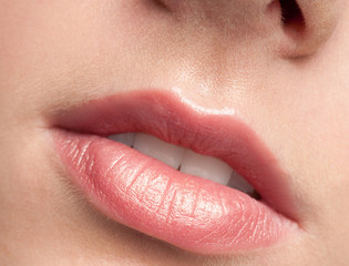 Fototapeta premium Close-up lips of beauty young woman