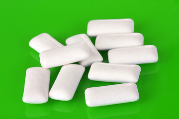 Chewing gums on green background