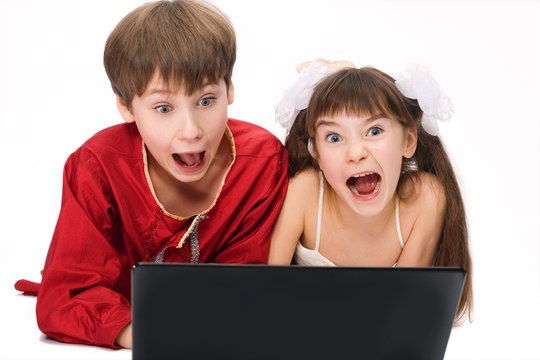 Kids with laptop.