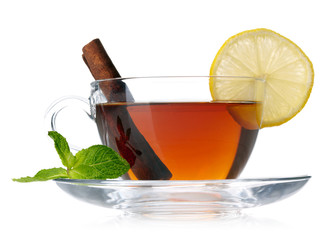 Cup of tea with lemon, cinnamon and mint