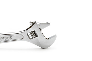 Metallic spanner on the white background