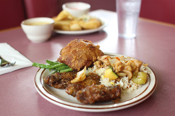 Chinese fried rice with chicken sides.