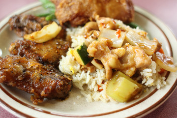 Chinese fried rice with chicken sides.