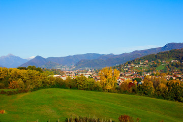 autumn landscape of fields and mountains Alps, Lombardia, Italy