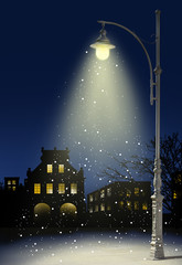 snow falls in the city at night