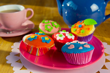 Cup cakes with tea