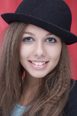 woman wth beautiful smile and hat