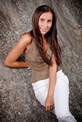 Happy young model next to concrete.