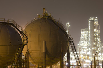 Oil-refinement plant and gas storage tanks