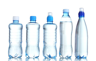 Group plastic bottles of water isolated on white