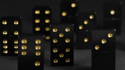 black dominoes with golden spots
