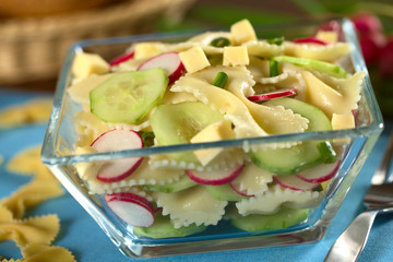 Pasta salad with cucumber, radish, cheese and chives