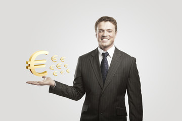 Young  businessman chooses a Gold Euro Signs