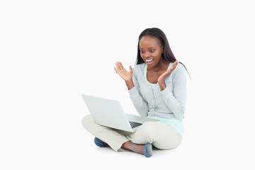 Young woman happy about whats on her screen