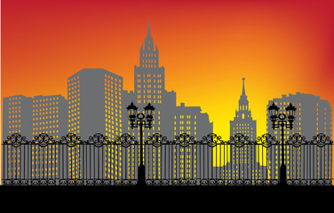 Obraz premium sunset town landscape with fence