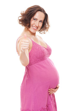 pregnant woman showing thumbs up
