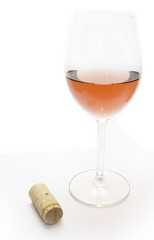 Wine corks and glass of red wine