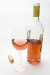 Wine corks and glass of red wine