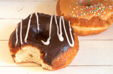 Donuts covered in caramel and chocolate icing
