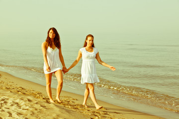 Female Friends Walking Together in the Seaside