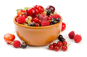 Mixed berries in bowl isolated on white