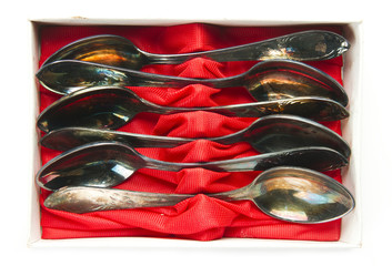 old group of teaspoons in box