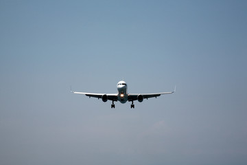 Fototapeta na wymiar Aeroplane coming into land at Skiathos, Greece