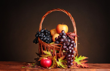 beautiful autumn harvest in basket and leaves