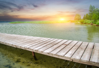 Fototapeta na wymiar Wooden pier on beautiful lake.Nature composition.