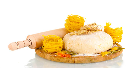 ingredients for homemade pasta on wooden plate isolated on white