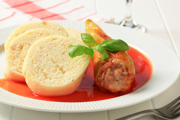 Stuffed pepper with tomato sauce and dumplings