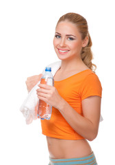 Young woman with towel and water bottle
