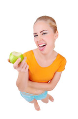 Young funny woman eat green apple