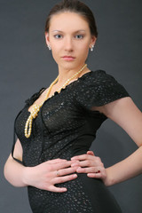 portrait of young caucasian girl in black dress