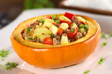Baked pumpkin with zucchini, bell pepper, minced meat, onions