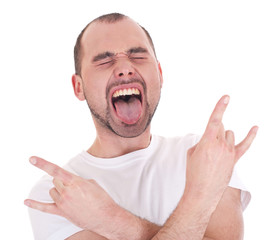 portrait of young man singing and doing rock and roll symbol ind