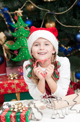 Merry Christmas - Cute girl making Christmas cookies