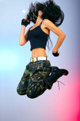 girl with gun in jump action