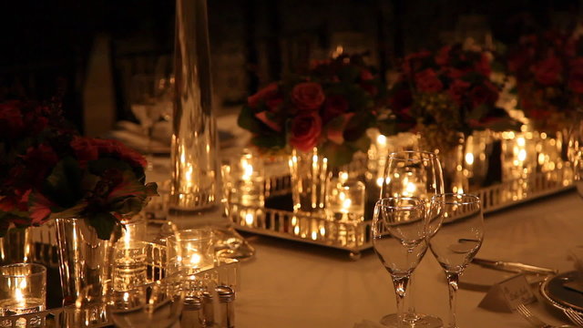 Elegant candlelight  dinner table setting at reception