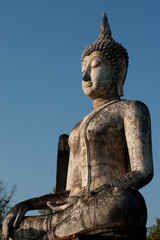 Obraz premium Outdoor ancient big Buddha in Sukhothai temple, Thailand .