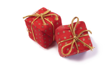 Two red Christmas presents on a white background
