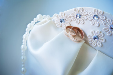 wedding rings on bridal handbag