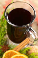 Hot mulled wine with spices and evergreen