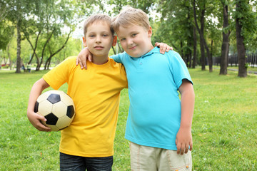 Fototapeta premium Boys in the park with a ball