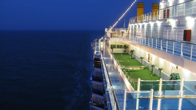 Golf pitch on cruise liner deck at evening time, time lapse