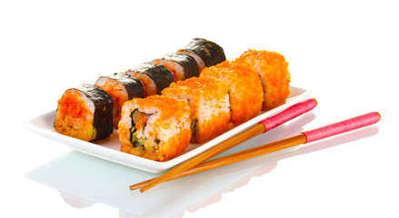 delicious sushi on plate and chopsticks isolated on white