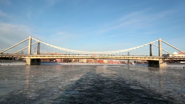 Ship sail along river away from Crimean bridge